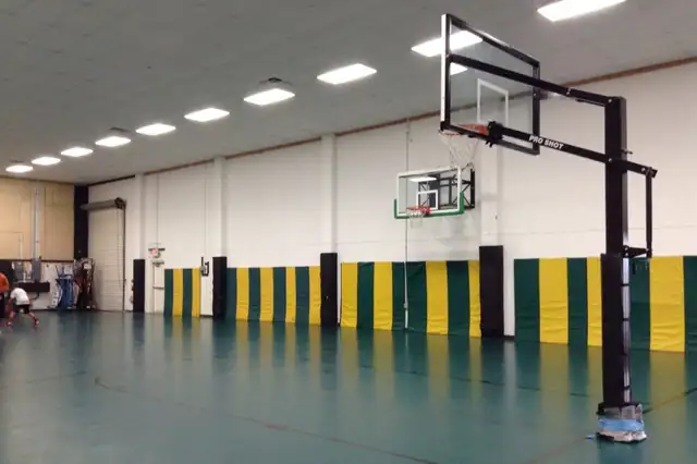 The original warehouse court: green and yellow walls over a bare concrete floor