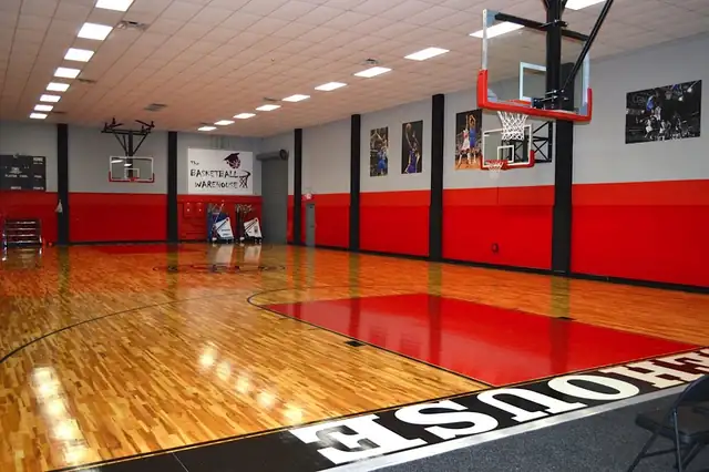 The renovated court: maple hardwood, red key and red padded walls