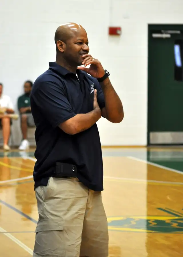 Coach Allen courtside at the Warehouse