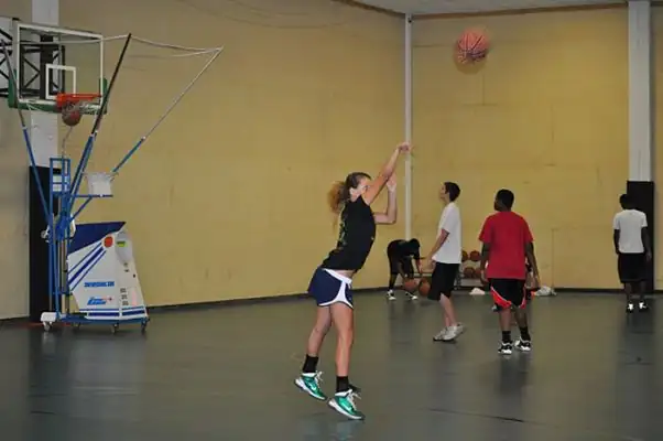 A player rises into her jump shot during a shooting session at the Warehouse