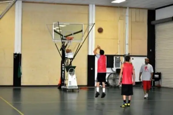 A player practicing with a shooting machine